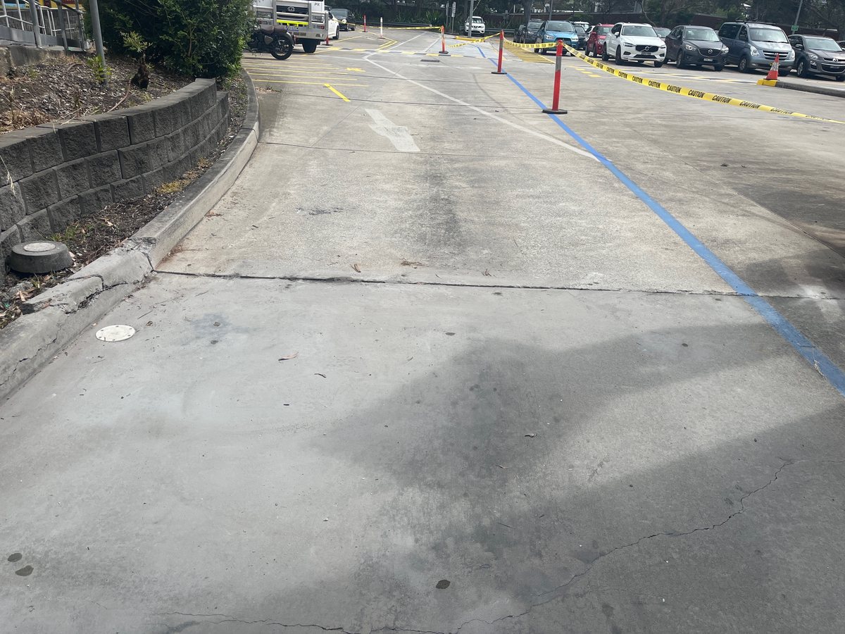 After: driveway slab lifted back flush and level